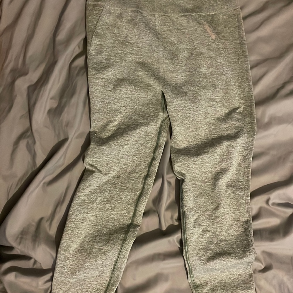 Gymshark light green leggings with pink logo.
